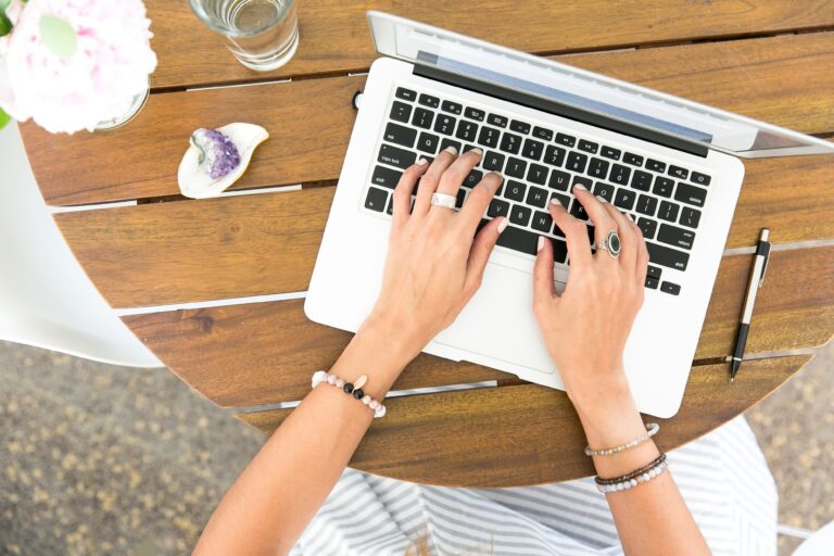 woman typing on laptop