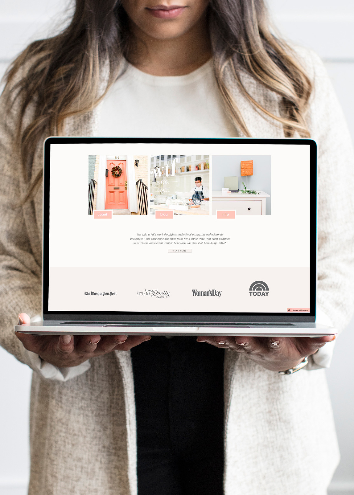 Woman holding laptop showing websites for photographers by web designer Jessie Mary & Co.