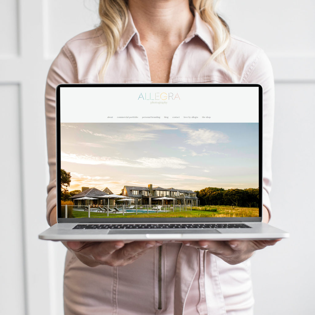 websites for photographers, woman holding laptop showing a photography website, by female web designer Jessie Mary & Co.