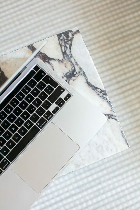 laptop on marble table