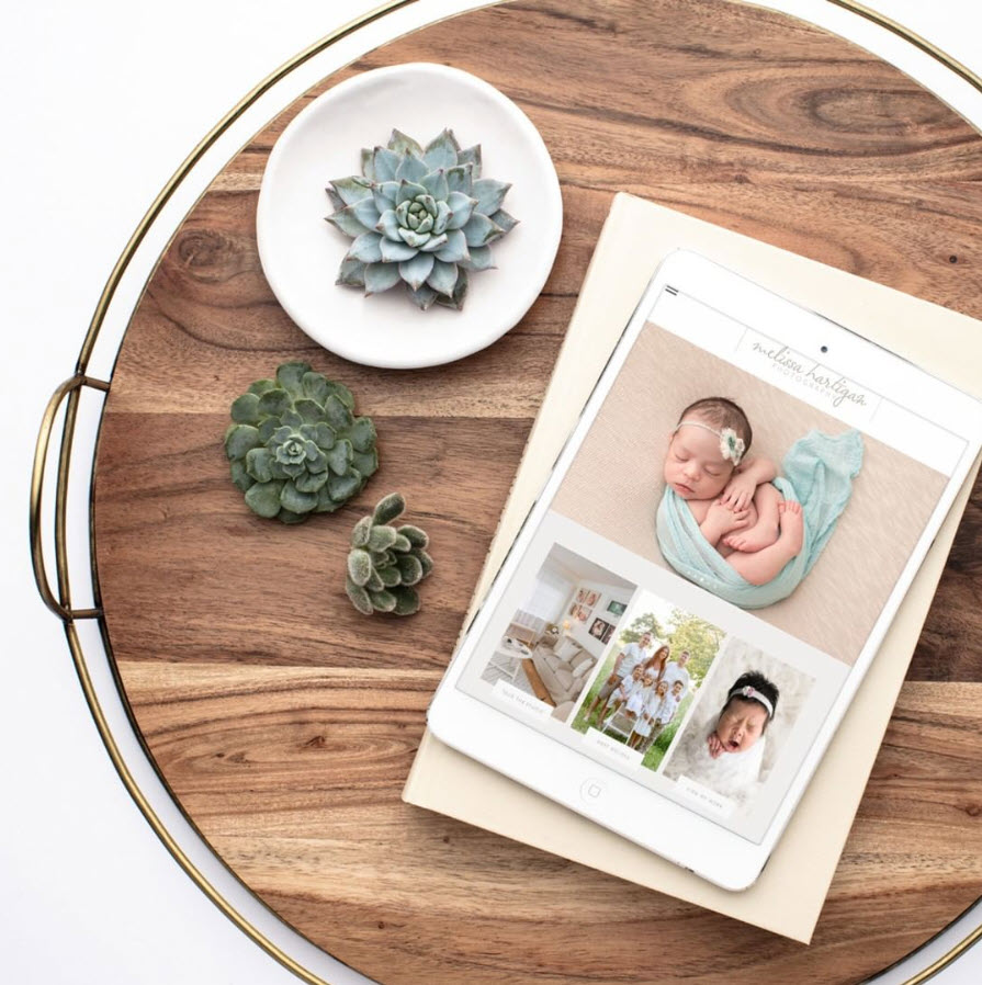 Websites for Photographers, tray with tablet showing newborn photographer website