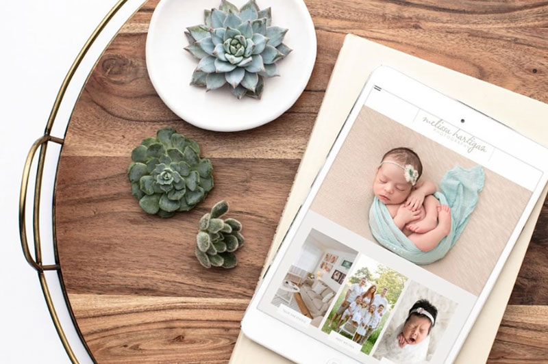 Websites for Photographers, tray with tablet showing newborn photographer website